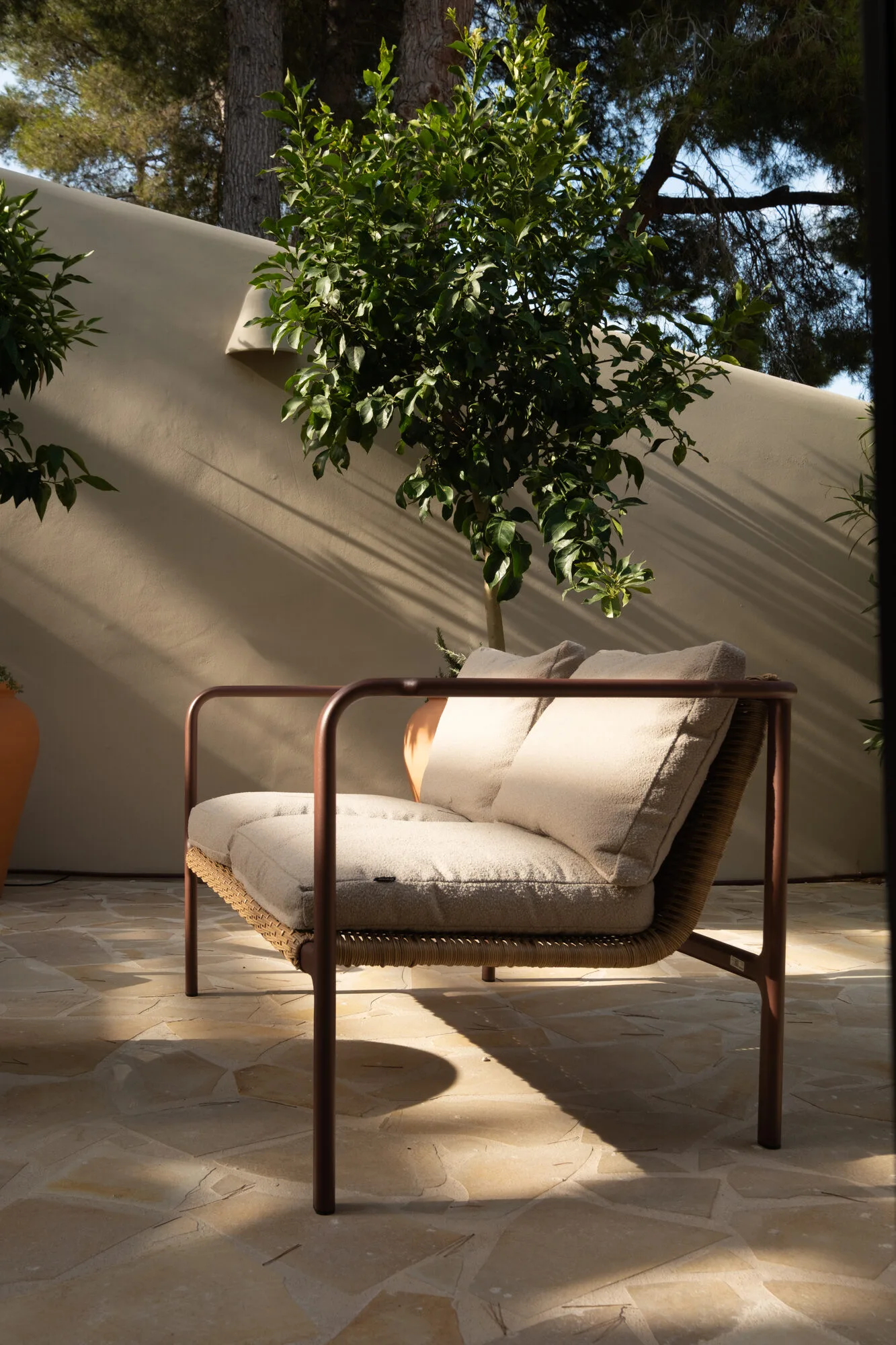 Outdoor armchair in shadow